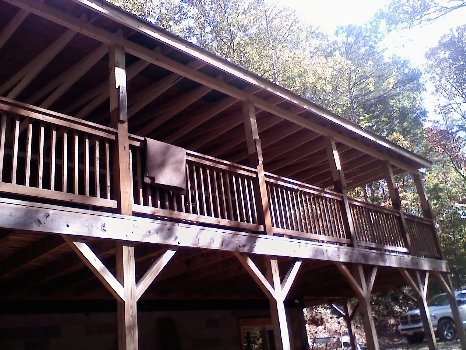 Timber framing under a new elevated porch and deck — Roof Leak Repair in Kalispell by Roofing Brothers